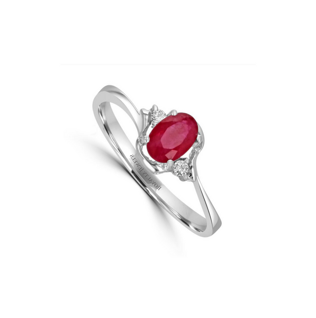 14K white gold ring featuring a oval ruby and two round diamonds on each side, delicate fine jewelry design

