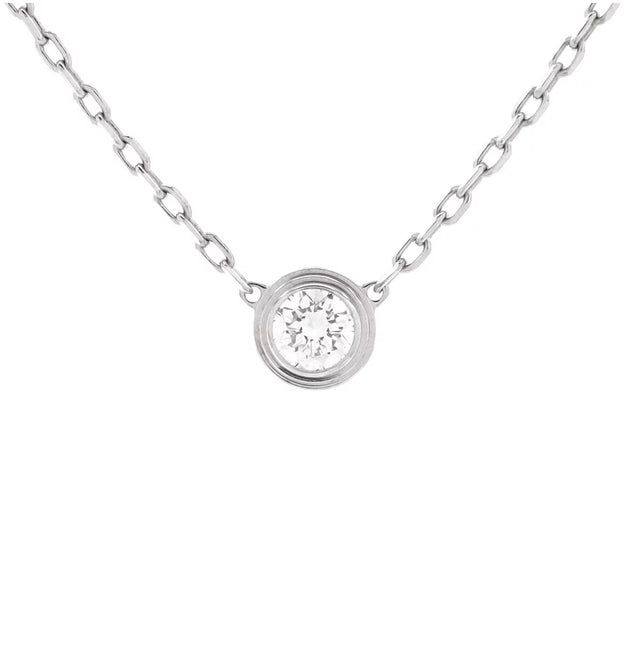 14K gold solitaire diamond necklace featuring a bezel-set round diamond on a delicate chain, designed for effortless elegance and everyday luxury.