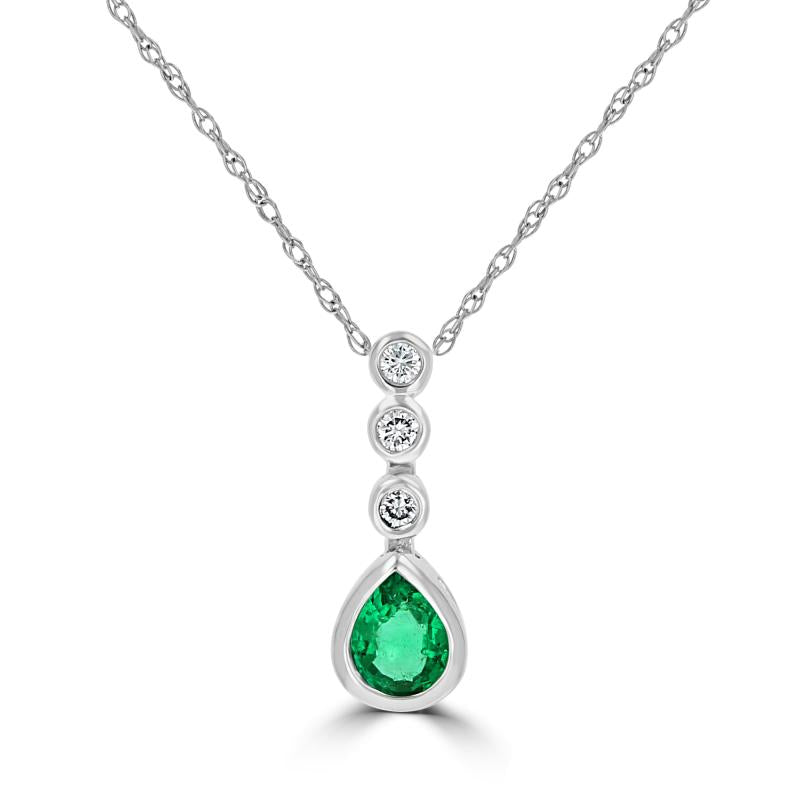 14K white gold pendant featuring bezel-set pear-shaped emerald and round diamonds on a dainty chain.