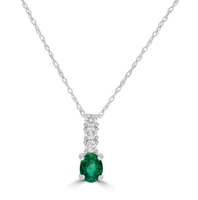 Elegant 14K white gold pendant with oval emerald and three round diamonds