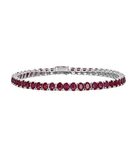 14K white gold tennis bracelet with oval rubies in prong setting