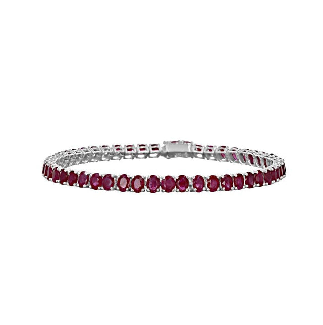 14K white gold tennis bracelet with oval rubies in prong setting