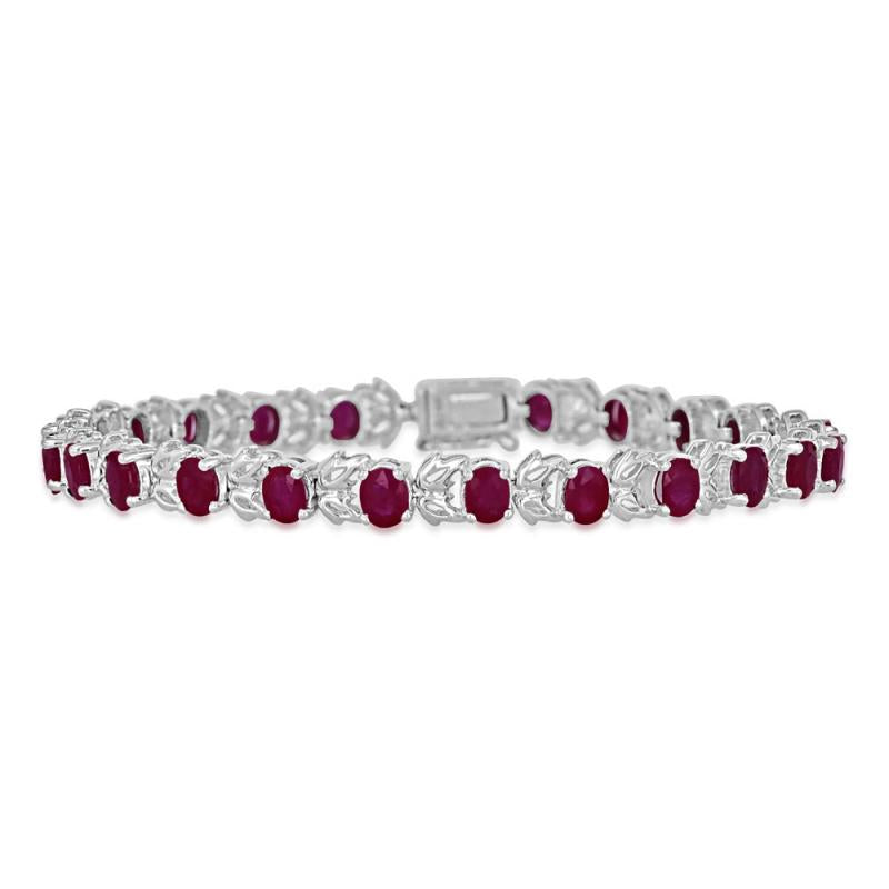 14K white gold ruby leaf tennis bracelet featuring oval 4x5mm rubies in a vine-inspired design.