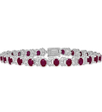 14K white gold ruby leaf tennis bracelet featuring oval 4x5mm rubies in a vine-inspired design.