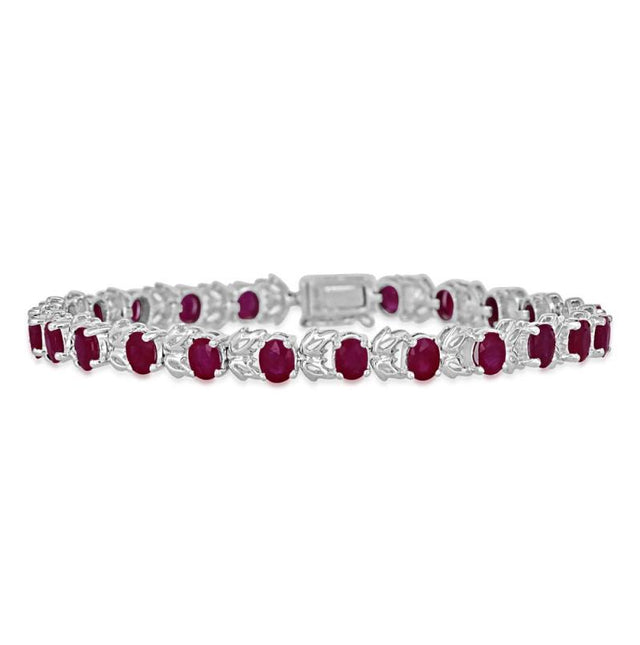 14K white gold ruby leaf tennis bracelet featuring oval 4x5mm rubies in a vine-inspired design.