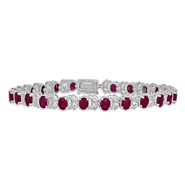 14K white gold ruby leaf tennis bracelet featuring oval 4x5mm rubies in a vine-inspired design.