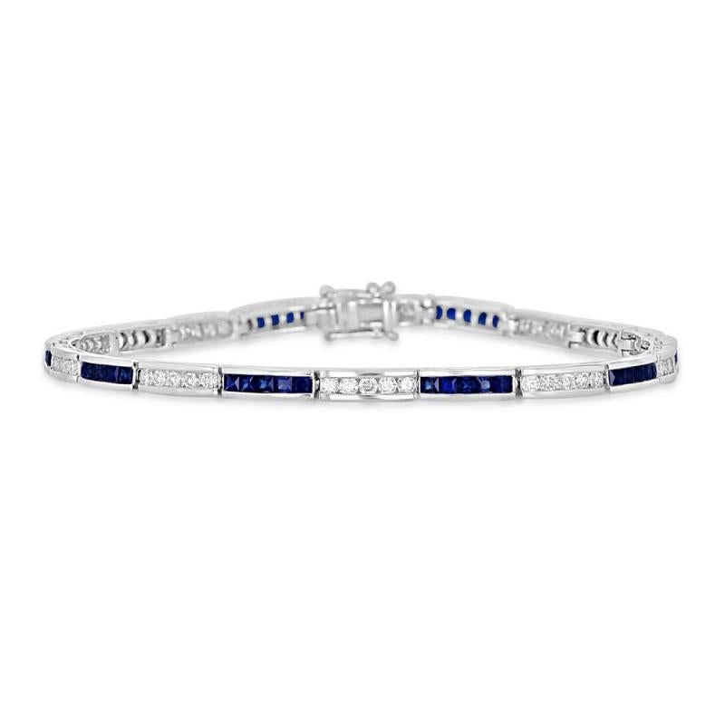 14K gold channel bracelet with round diamonds and square blue sapphires in an elegant setting