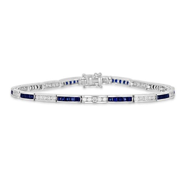 14K gold channel bracelet with round diamonds and square blue sapphires in an elegant setting