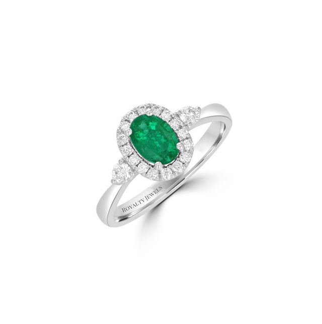 14K gold oval emerald halo ring with two round side diamonds


