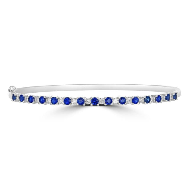 14K white gold bangle bracelet with alternating round sapphires and diamonds in prong setting