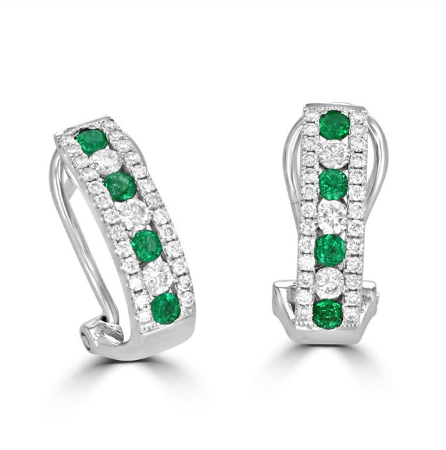 14K white gold omega hoop earrings with round emeralds and diamonds in a double halo prong setting

