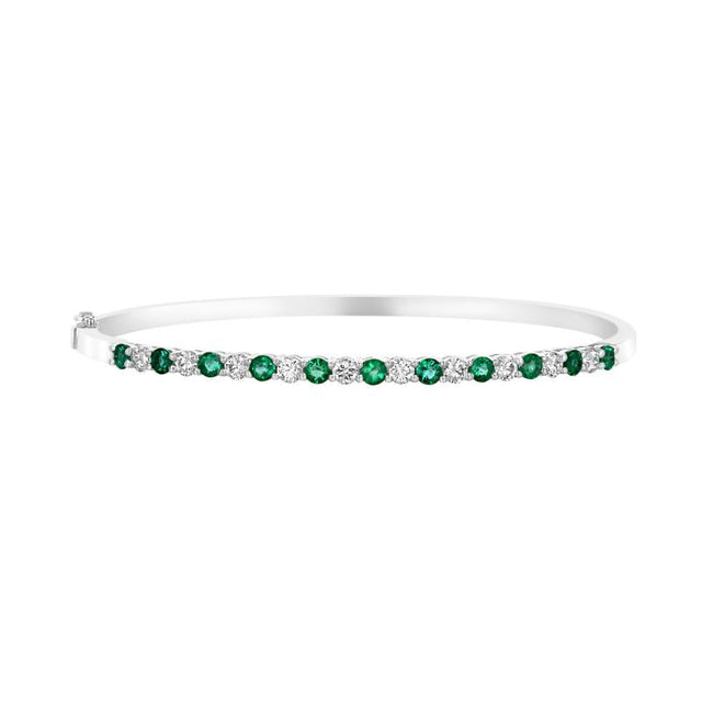 14K white gold bangle bracelet with alternating round emerald and diamond prong settings