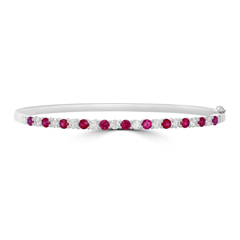 Elegant 14K gold bangle featuring round prong-set rubies and diamonds

