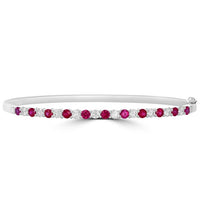 Elegant 14K gold bangle featuring round prong-set rubies and diamonds

