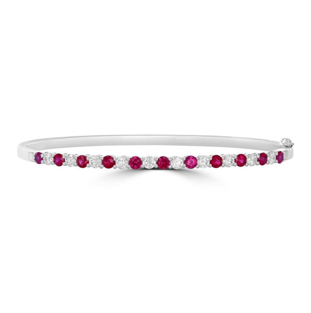 Elegant 14K gold bangle featuring round prong-set rubies and diamonds

