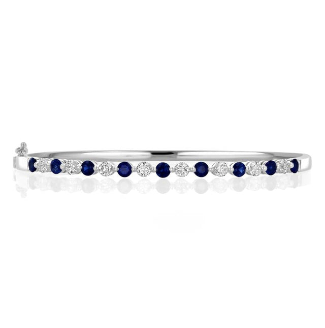Luxury 14K gold bangle bracelet with alternating round sapphires and diamonds in shared prong setting