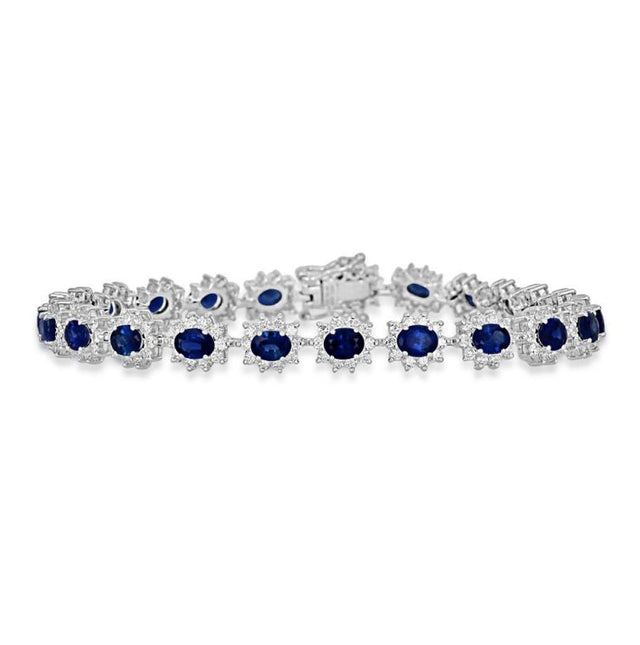 Elegant oval sapphire and diamond halo tennis bracelet in white gold