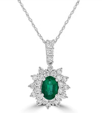 14K gold oval emerald halo pendant with diamond accents on white background