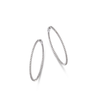 Luxury 14K gold diamond hoop earrings featuring pavé-set diamonds in a timeless and elegant design, available in yellow, white, and rose gold.


