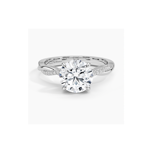 14K white gold engagement ring with infinity twist pavé band and round-cut lab-grown diamond. Elegant and timeless bridal jewelry.