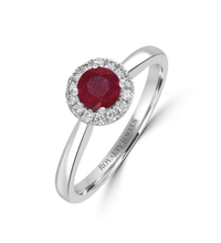 round ruby halo ring in 14K white gold with diamond accents