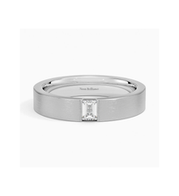 Men’s 14K gold wedding band with an emerald-cut diamond in a bezel setting. Sleek, modern, and sophisticated for a timeless luxury look.