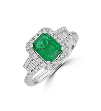 14K gold emerald cut emerald ring with round and baguette diamond halo setting