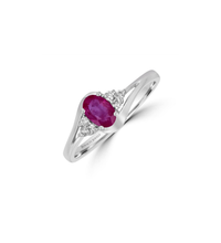 Elegant 14K white gold ring featuring a oval ruby flanked by three dazzling round diamonds on each side

