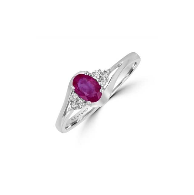 Elegant 14K white gold ring featuring a oval ruby flanked by three dazzling round diamonds on each side

