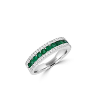 14K white gold band ring featuring alternating round emerald and diamond stones in a channel setting.


