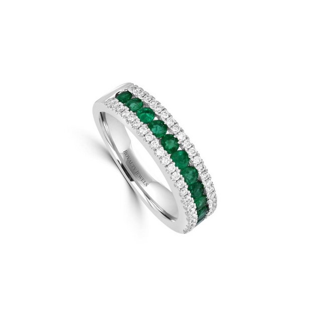 14K white gold band ring featuring alternating round emerald and diamond stones in a channel setting.


