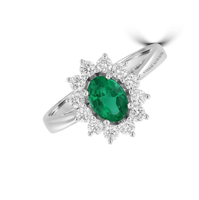 oval emerald ring surrounded by round diamonds in a 14K white gold halo setting