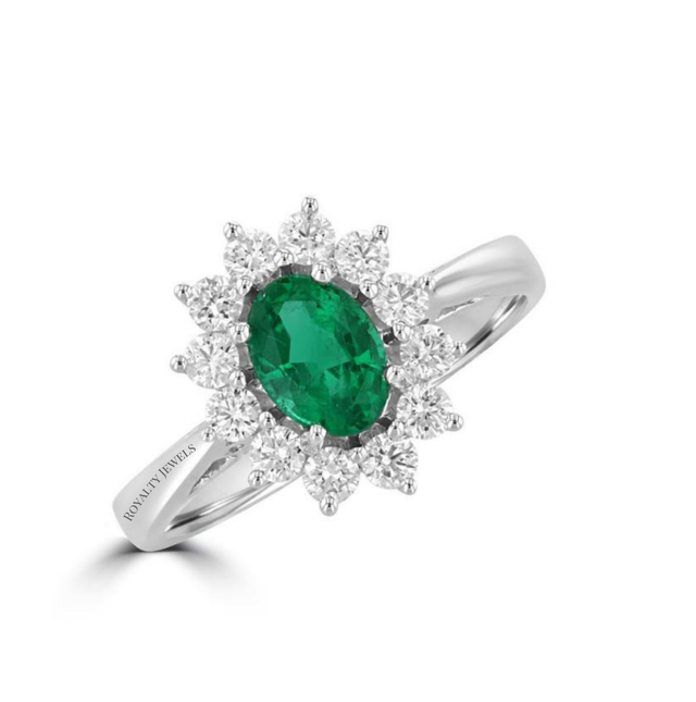 oval emerald ring surrounded by round diamonds in a 14K white gold halo setting