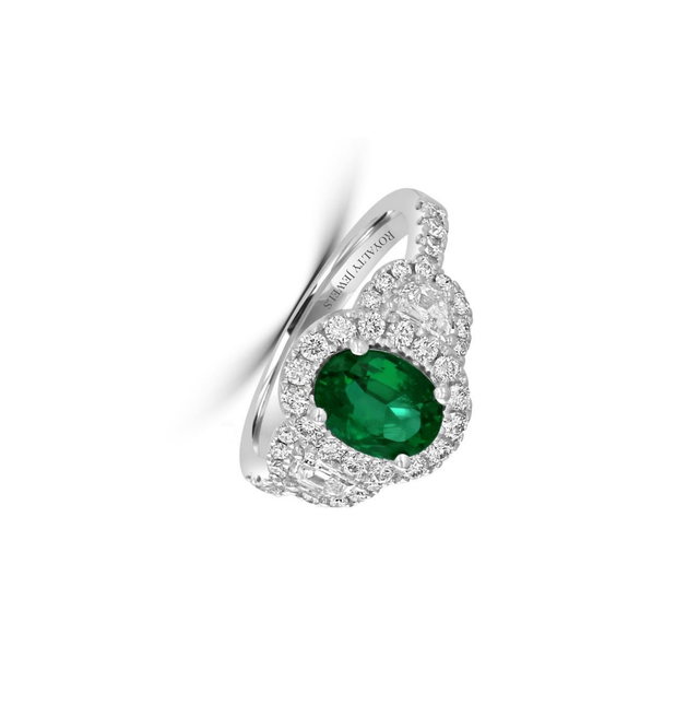 Luxury oval emerald and diamond halo ring set in 14K white gold, featuring brilliant-cut diamonds on a polished band.

