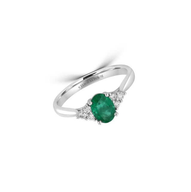 14K gold oval emerald halo ring with two round side diamonds

