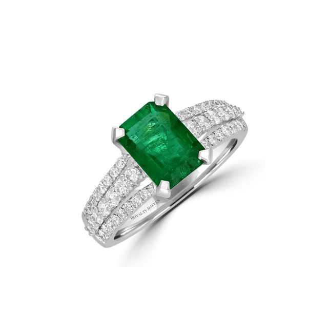 14K white gold ring featuring emerald-cut emerald with three rows of round diamonds on shank

