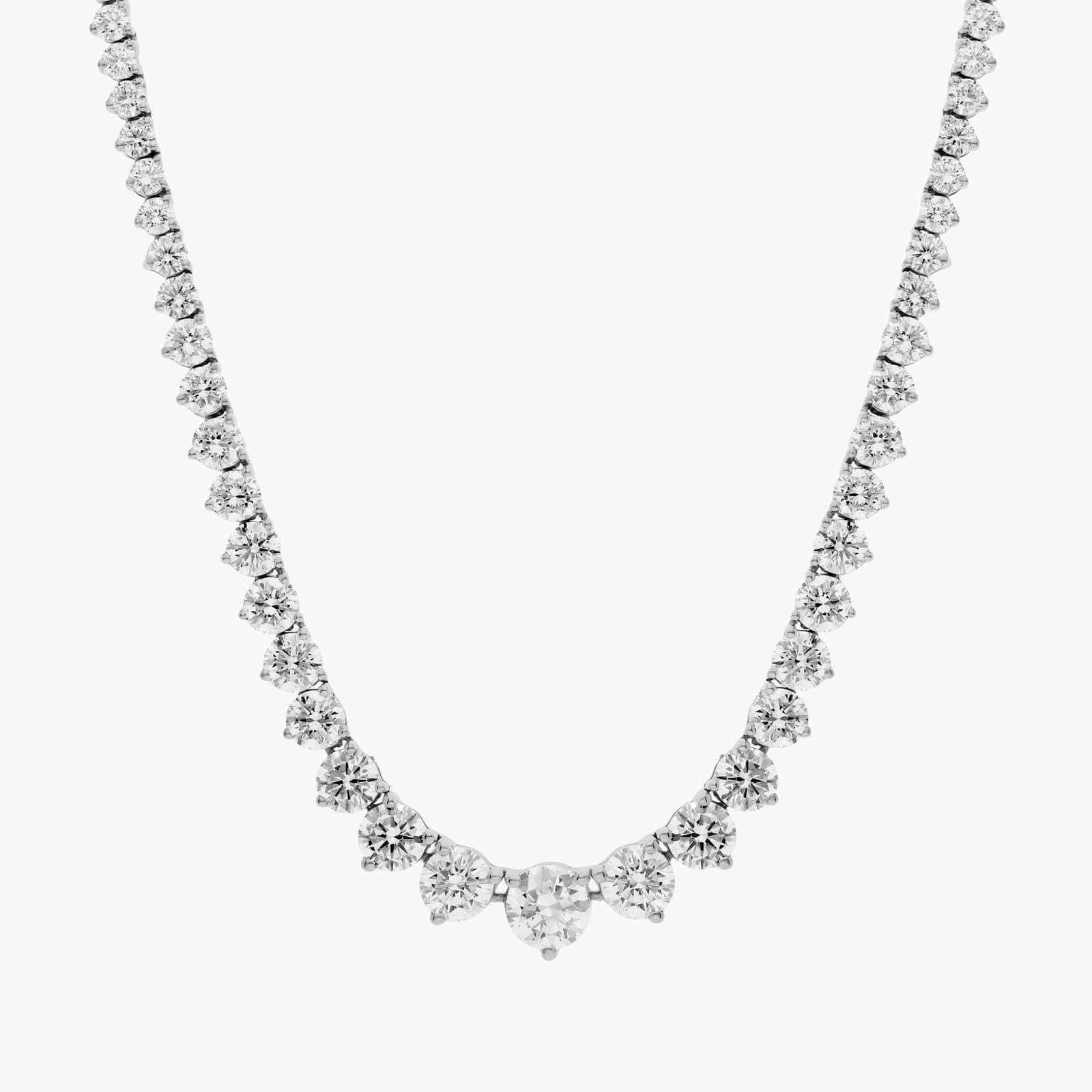 Close-up and model view of a 14K gold graduated diamond tennis necklace featuring round brilliant lab-grown diamonds in a classic prong setting.

