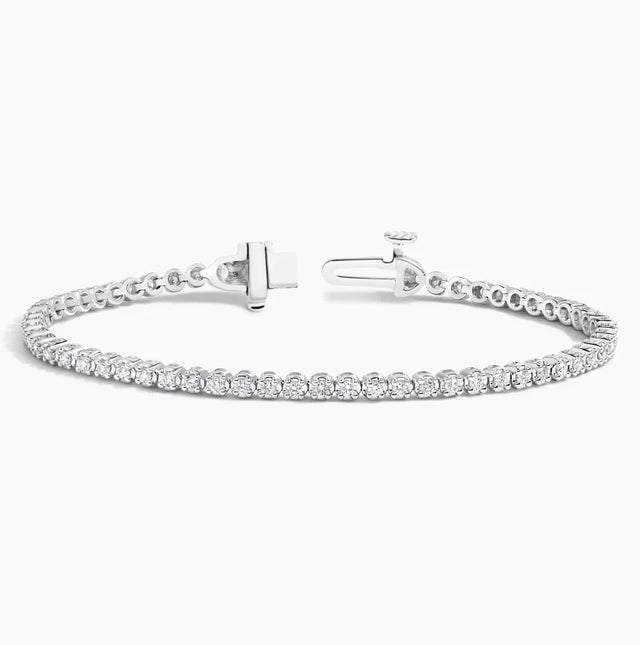 14K gold diamond tennis bracelet with lab-grown diamonds in a classic, elegant design. Available in White, Yellow, and Rose Gold.

