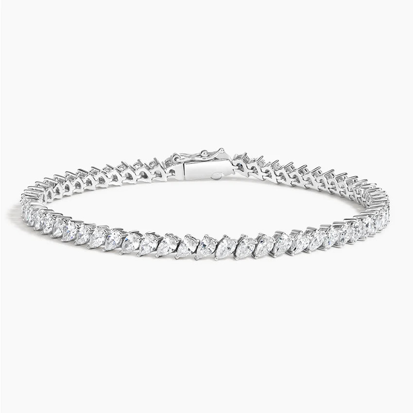A stunning 14K gold diamond tennis bracelet featuring pavé-set teardrop diamonds, available in white, yellow, or rose gold. Luxury fine jewelry for women.

