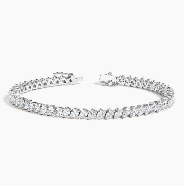 A stunning 14K gold diamond tennis bracelet featuring pavé-set teardrop diamonds, available in white, yellow, or rose gold. Luxury fine jewelry for women.

