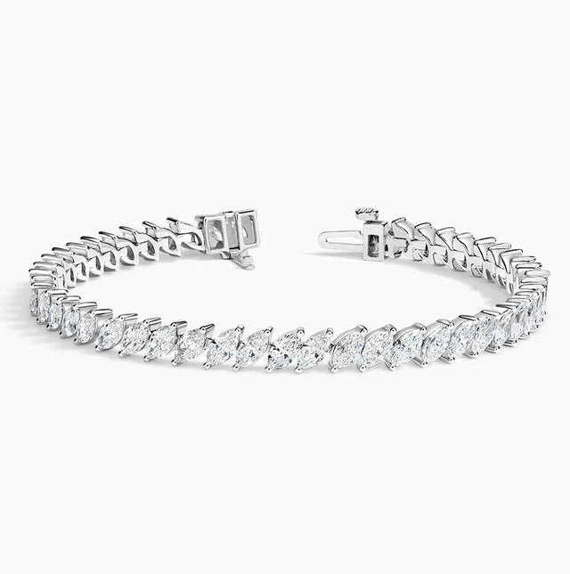 Luxury 14K gold marquise diamond tennis bracelet with ethically sourced diamonds. Elegant, handcrafted fine jewelry perfect for special occasions.