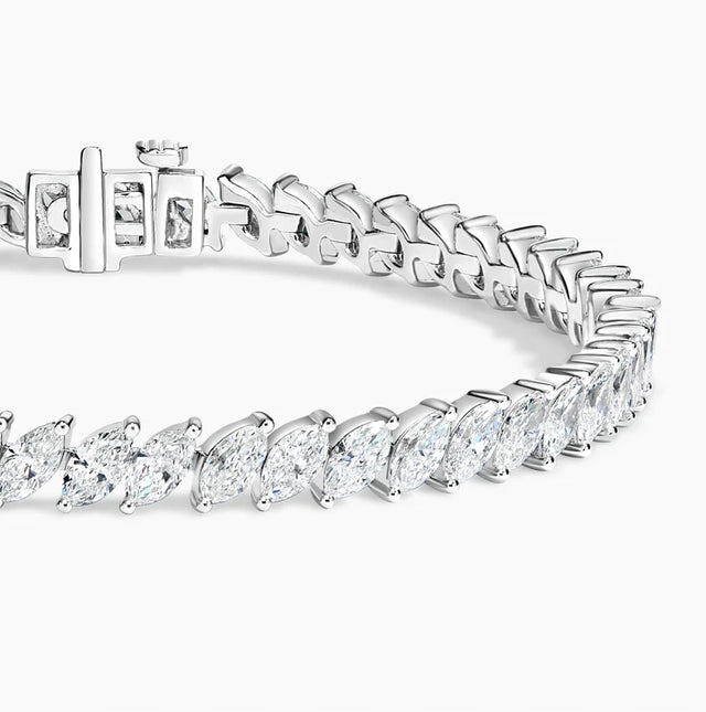 Luxury 14K gold marquise diamond tennis bracelet with ethically sourced diamonds. Elegant, handcrafted fine jewelry perfect for special occasions.