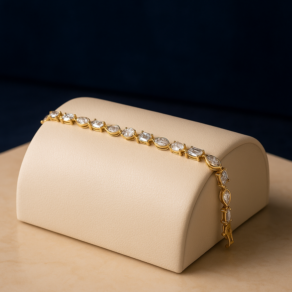 “Luxury 14K gold bracelet with lab-grown diamonds in pear, marquise, emerald, oval, and round shapes, elegant sustainable fine jewelry.”