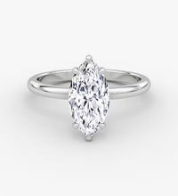 Elegant marquise diamond ring in 14K gold with pavé-set halo and cluster side accents, available in yellow, white, rose gold, or platinum.

