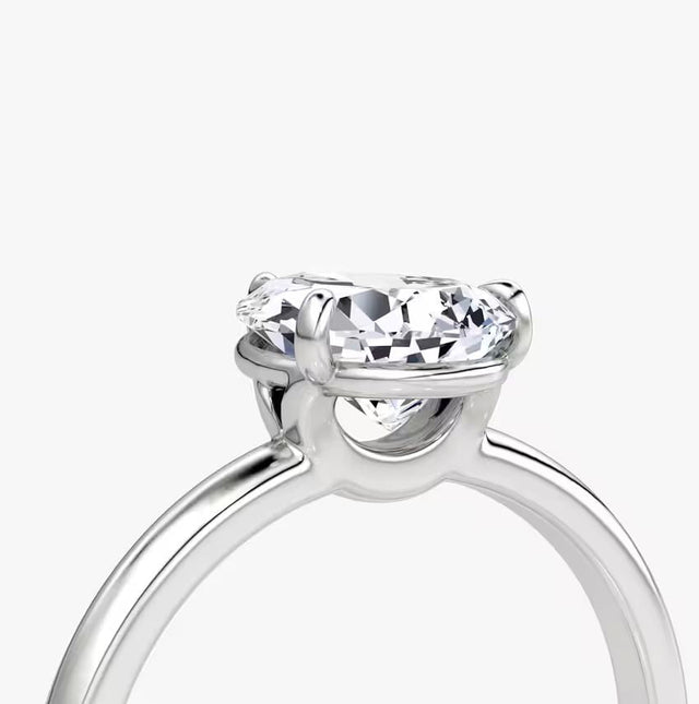 14K gold band with pear-cut lab-grown diamond in elegant solitaire setting

