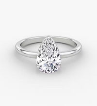 14K gold band with pear-cut lab-grown diamond in elegant solitaire setting

