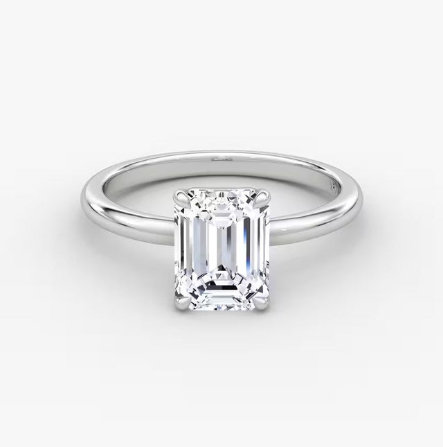 14K gold emerald-cut diamond band with center stone in a timeless setting